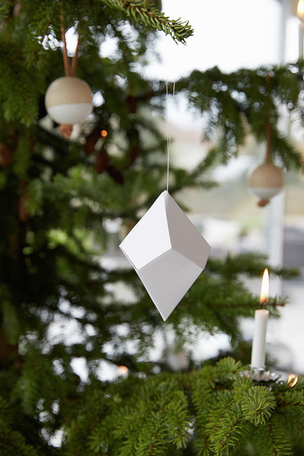 Christmas Tree Decorated With Origami, Wooden Baubles And Candles Photograph by Birgitta Wolfgang Bjornvad