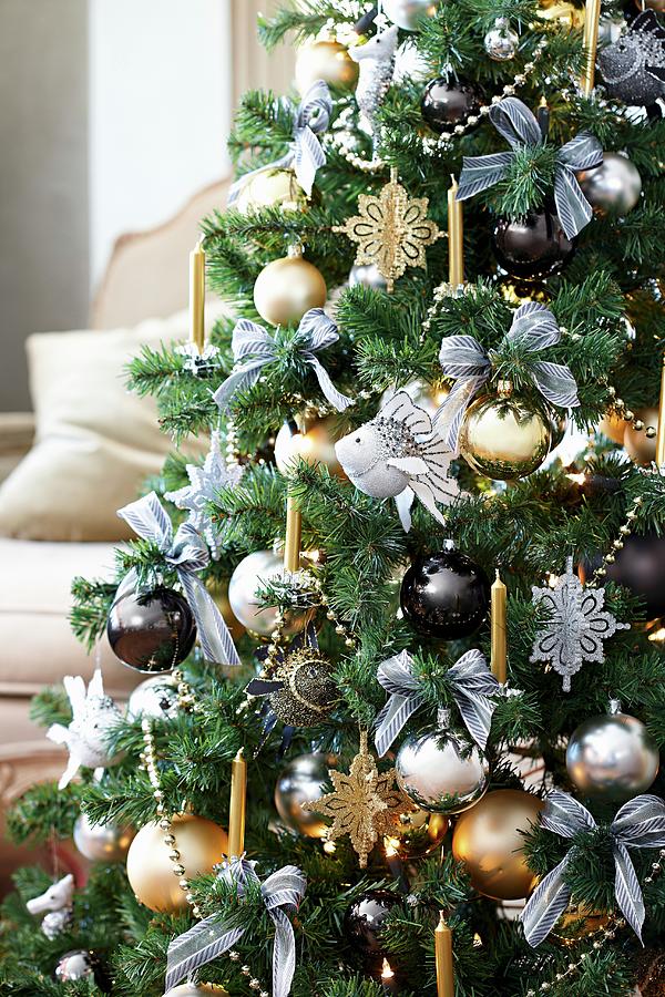 Christmas Tree Decorated With Ornamental Fish And Metallic Baubles Photograph by Biglife