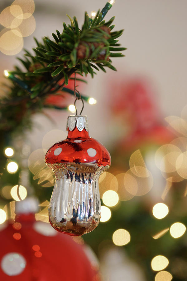 Christmas-tree Decoration In Shape Of Fly Agaric Mushroom And Sparkling Lights Photograph by Angelica Linnhoff