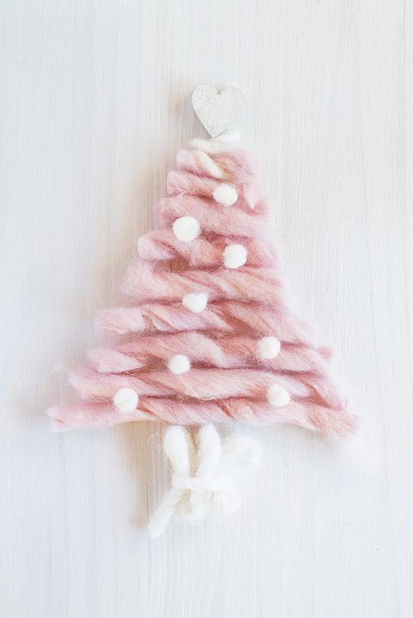 Christmas Tree Formed From Sections Of Pink Wool On White Surface Photograph by Sonia Chatelain