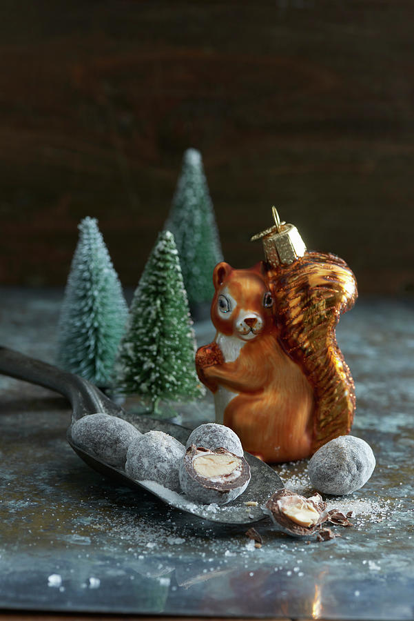 Christmas Truffles, Squirrel-shaped Bauble And Tiny Christmas Trees Photograph by Inge Ofenstein