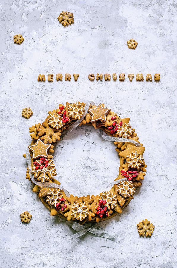 Christmas Wreath Of Gingerbread Dough In The Shape Of Stars And Snowflakes, Barberry Twigs, Tied With A Silver Ribbon Photograph by Gorobina