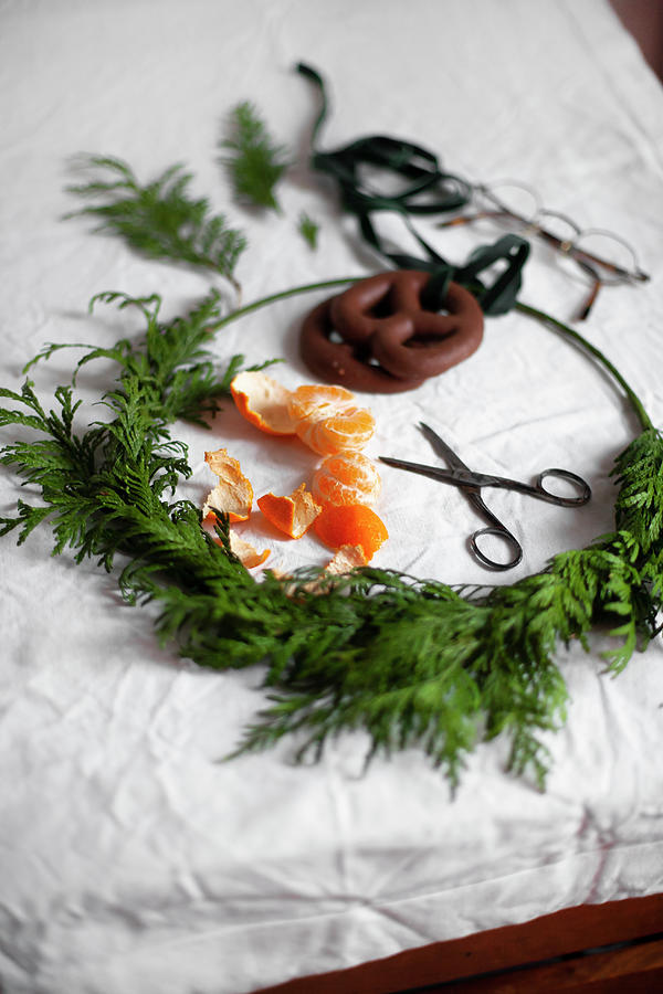 Christmas Wreath, Tangerine, Scissors And Gingerbread Pretzels Photograph by Alicja Koll