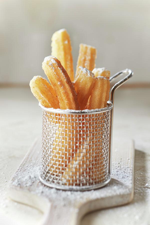 Churros With Icing Sugar Photograph by Barret