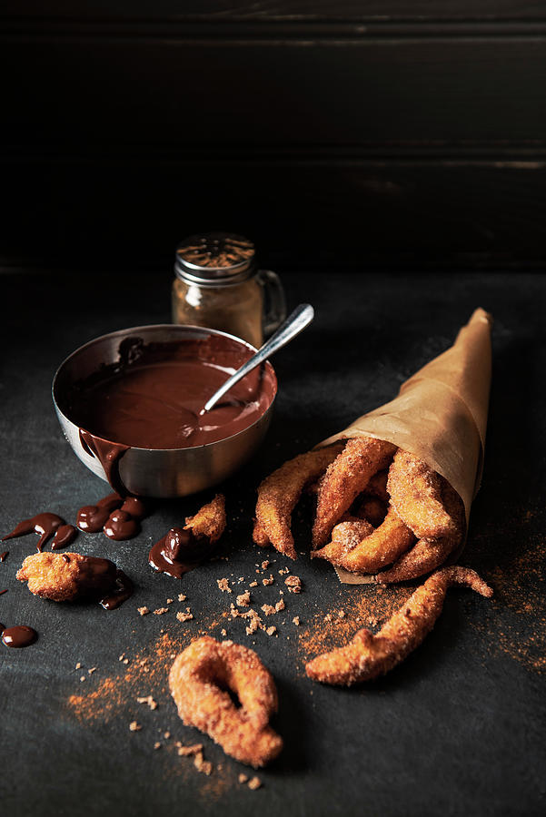 Churros With Sugar Cinnamon And Dark Chocolate Sauce For Dipping Photograph by Magdalena Hendey