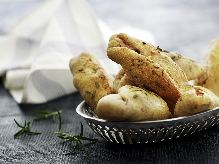 Ciabatta Rolls With Rosemary In A Metal Basket Photograph by Mikkel Adsbl