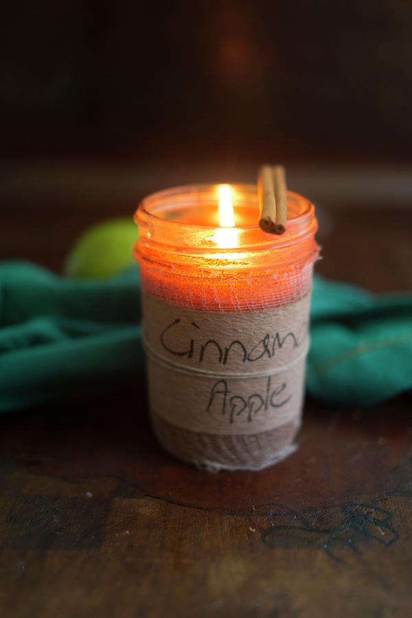Cinnamon And Apple Scented Candle In Jar Photograph by Eising Studio