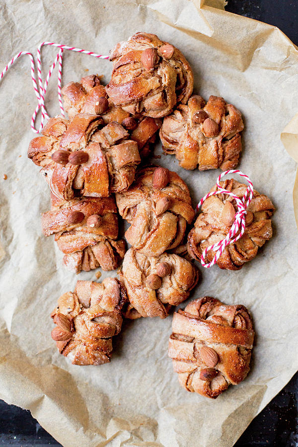 Cinnamon And Cardamom Buns On Baking Paper Photograph by Claudia Timmann