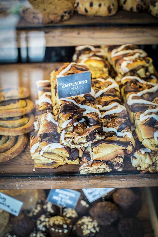 Cinnamon Buns At The Torvehallerne Market In Copenhagen Photograph by Anne Faber