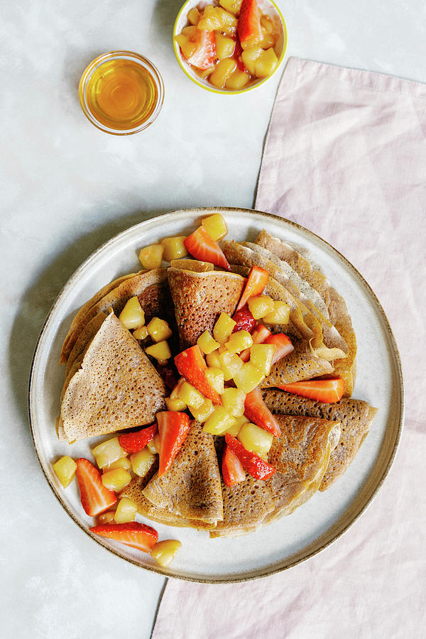 Cinnamon Crepes With Caramelized Apples And Strawberries Photograph by Alla Machutt