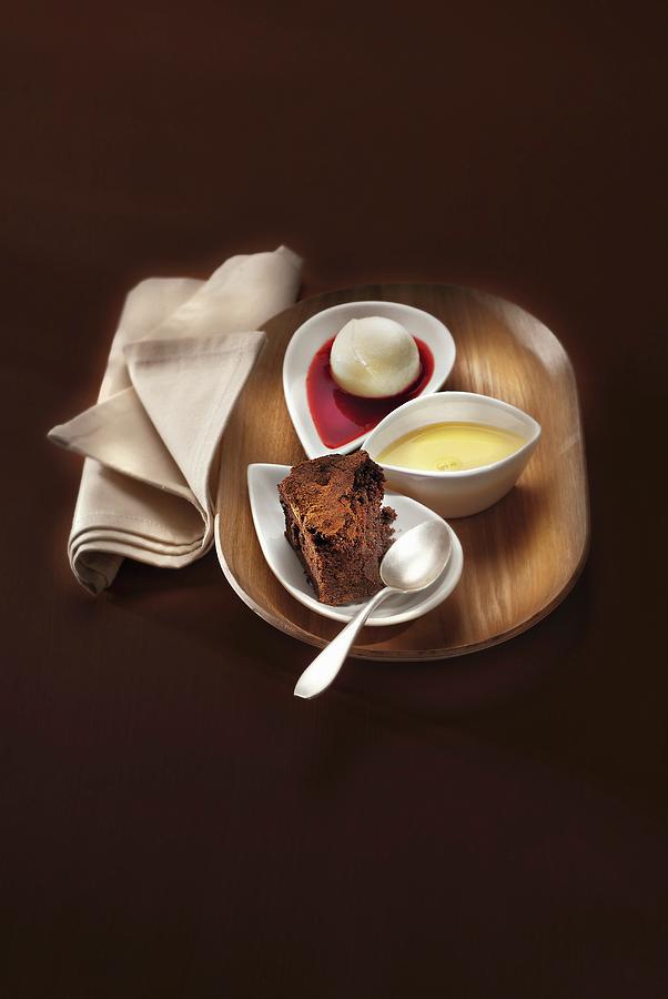 Cinnamon-flavored Brownie With A Scoop Of Ice Cream, Custard And Summer Fruit Coulis Photograph by Perrin