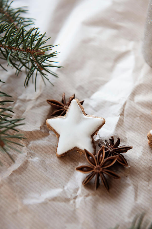 Cinnamon Star Biscuits, Star Anise And Fir Branches On Brown Paper Photograph by Jelena Filipinski