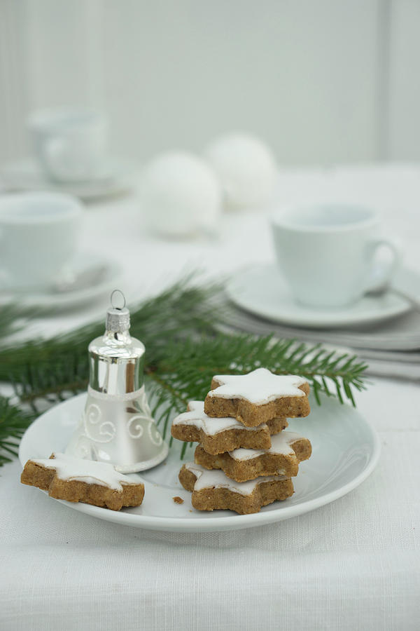 Cinnamon Stars And Christmas Decorations On A Plate Photograph by Martina Schindler
