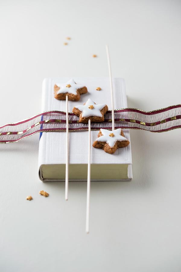 Cinnamon Stars Decorated With Mini Sugar Stars On Sticks Photograph by Mandy Reschke