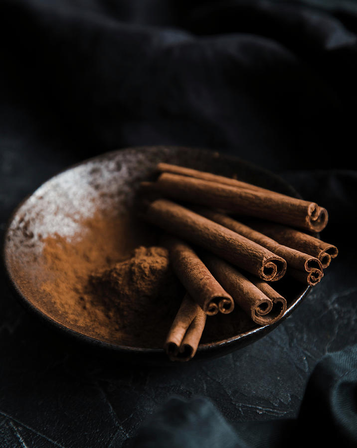 Cinnamon Sticks And Powder In A Bowl, On A Dark Background Photograph by Anna Jakutajc-wojtalik
