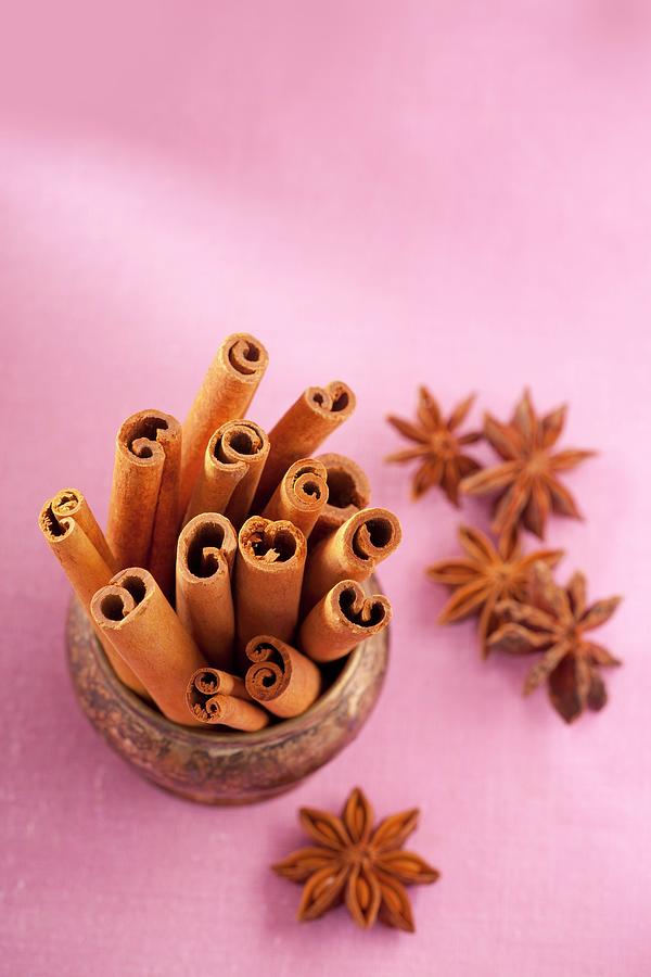Cinnamon Sticks In A Bowl, With Star Anise To The Side Photograph by Bertrand Limbour