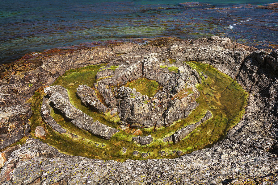 Circular geological feature on rocky beach Photograph by Sophie McAulay