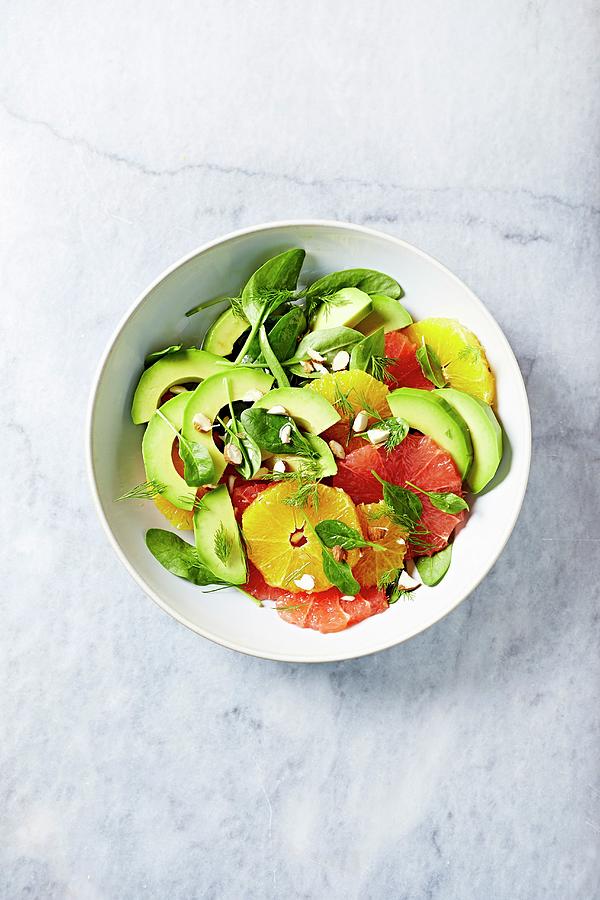 Citrus And Avocado Salad With Baby Spinach And Almonds Photograph by B.&.e.dudzinski