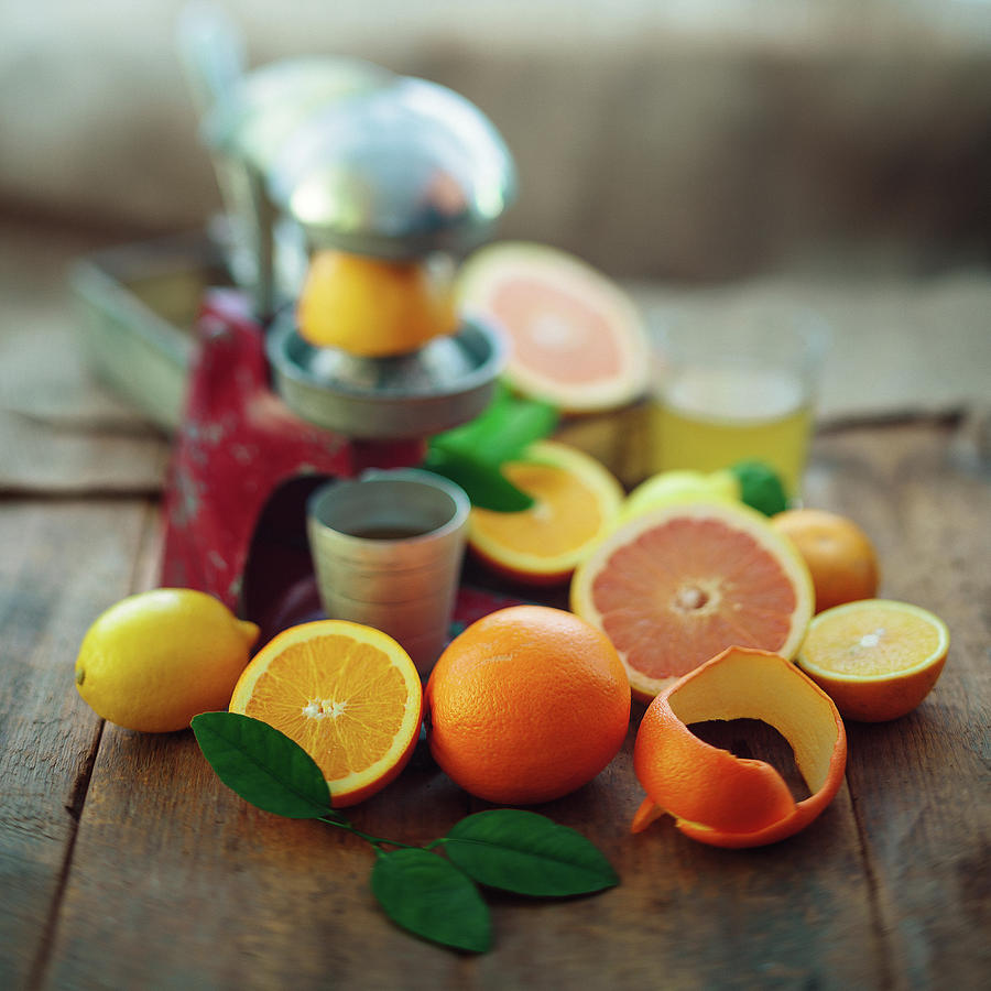 Citrus And Squeezer Photograph by Thepalmer