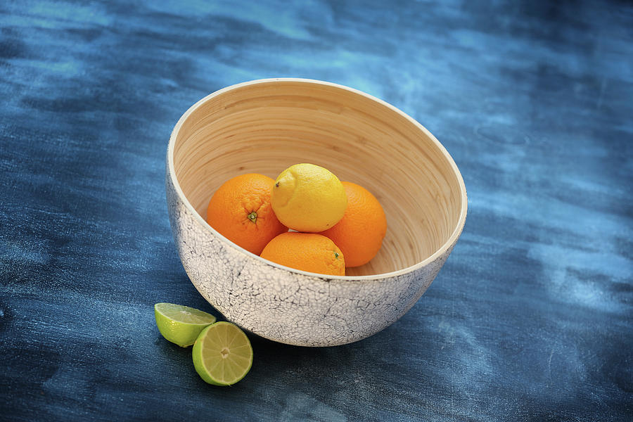 Citrus Fruits In A Decorative Bowl Photograph by Jalag / Michael Bernhardi