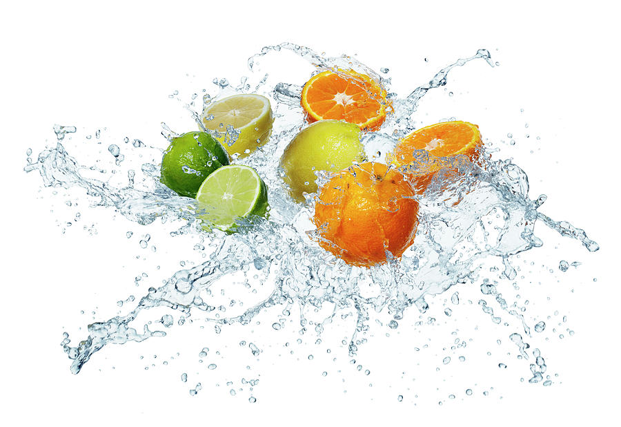 Citrus Fruits In A Splash Of Water Photograph by Krger & Gross