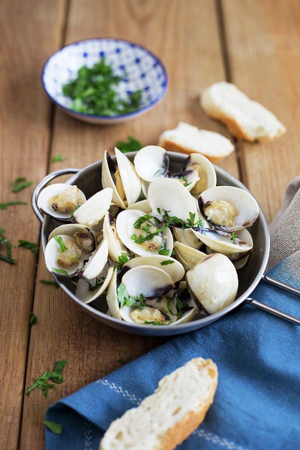 Clams In White Wine With Coriander, Garlic And Bread Photograph by Joana Leito