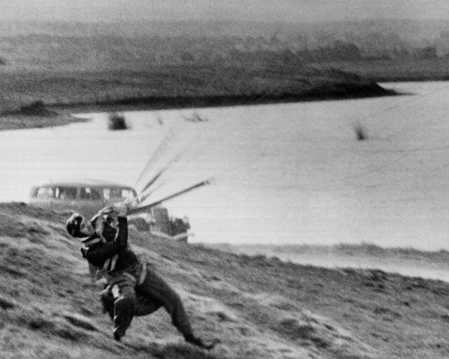 Clark Glabe Landing On Landscape With Parachute Photograph by Globe ...