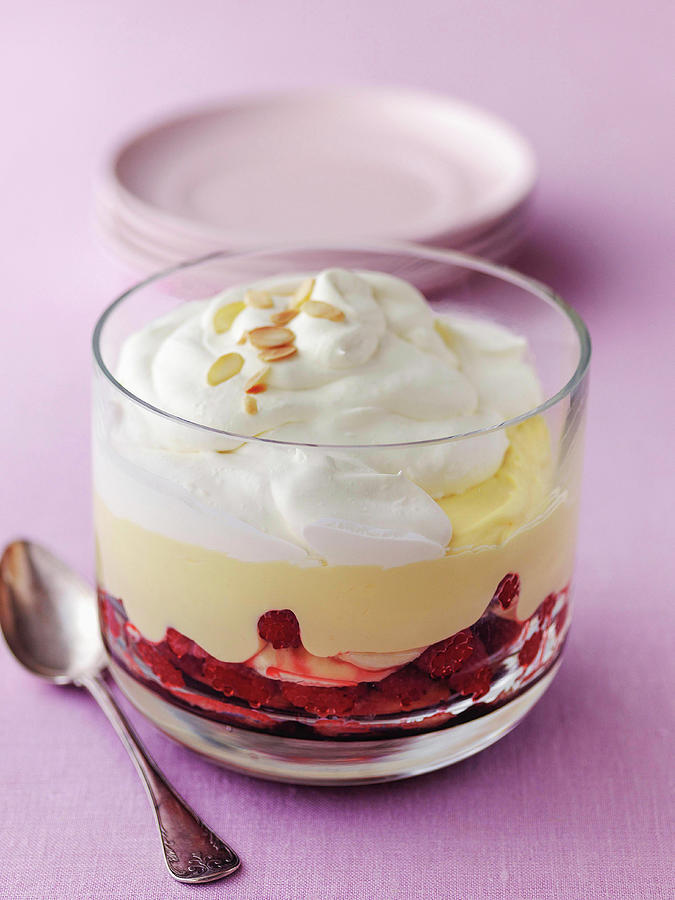 Classic British Trifle In Glass Bowl Made From Raspberries Sponge Custard And Cream Topped With Roasted Almonds Photograph by Michael Paul