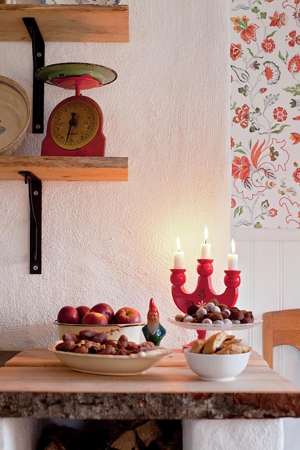 Classic Christmas Snacks Such As Nuts, Apples And Chocolates Photograph by Camilla Isaksson
