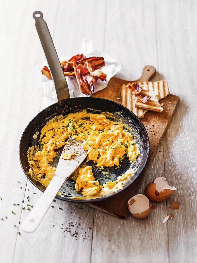 Classic Scrambled Eggs With Bacon And Toast Photograph by Thorsten Kleine Holthaus