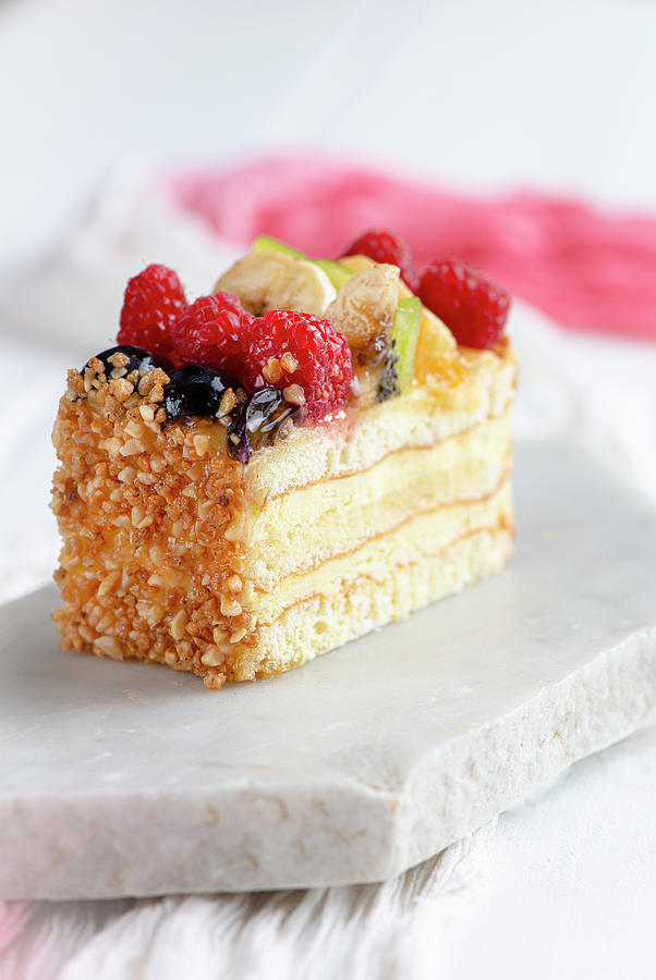 Classic Vanilla And Sponge Fruit Slice Decorated With Chopped Nuts Photograph by Jamie Watson