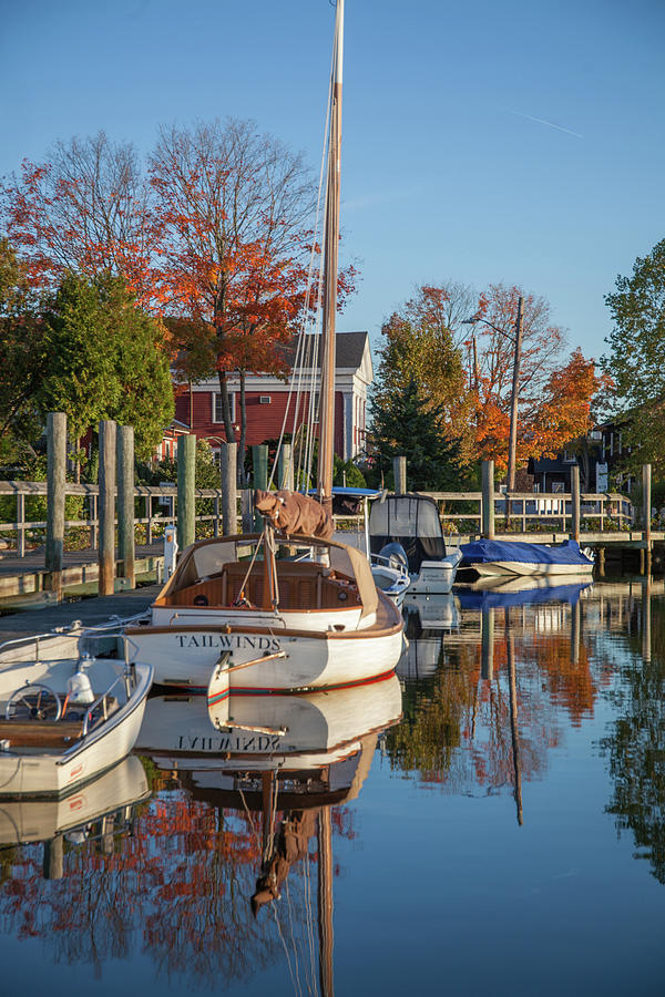 Classic Wooden boat in Mystic River harbor Photograph by Cliff Wassmann