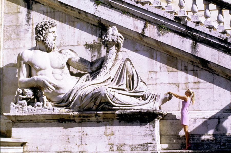 Claudia Schiffer With A Roman Statue Photograph by Arthur Elgort