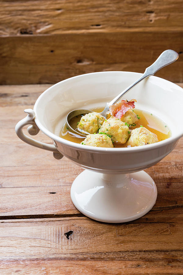 Clear Broth With Bacon Dumplings Photograph by Anneliese Kompatscher