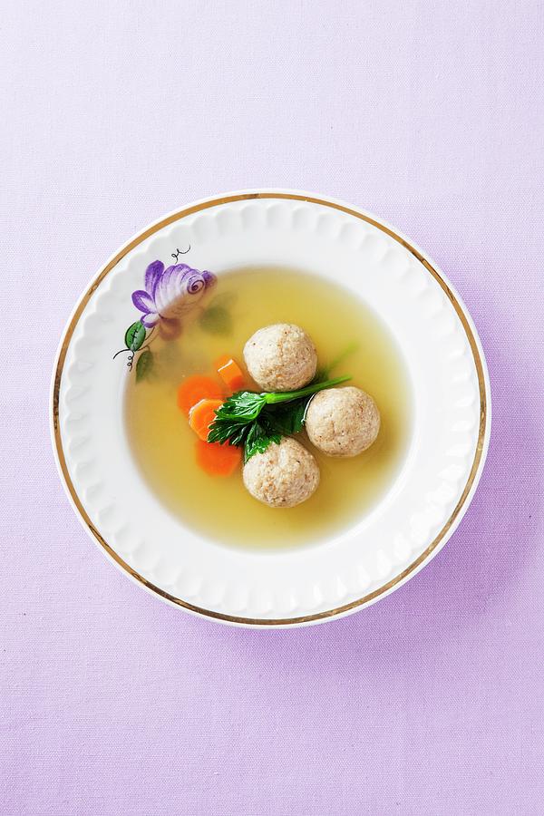 Clear Broth With Carrots And Matze Dumplings Photograph by Danny Lerner