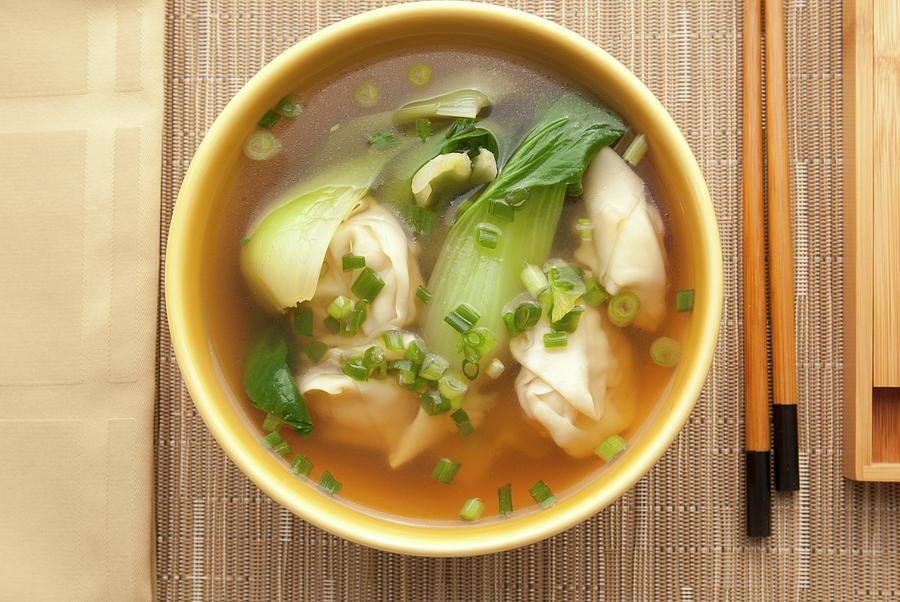 Clear Soup With Prawn Wontons And Bok Choy Photograph by William Boch
