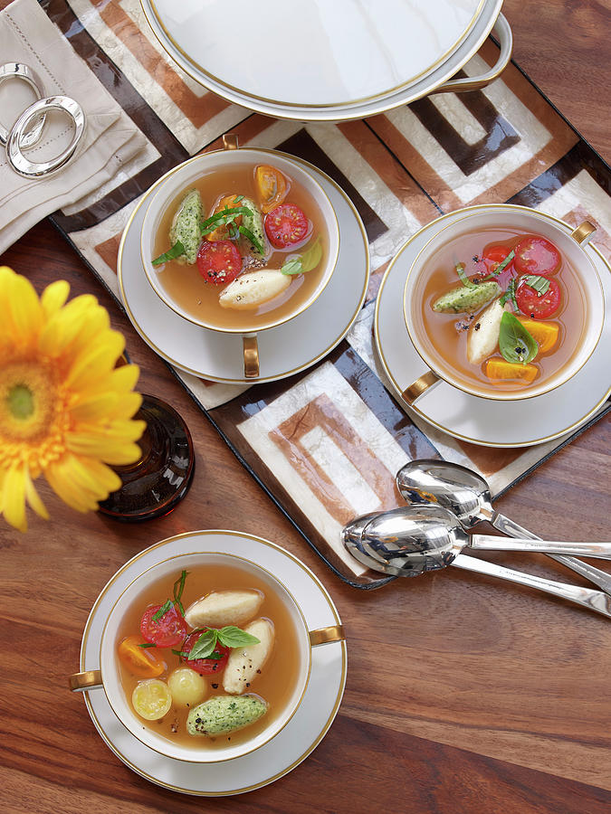 Clear Tomato Soup With Cheese Dumplings Photograph by Jan-peter Westermann