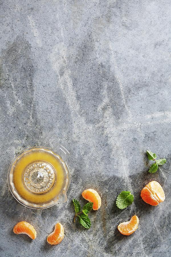 Clementine Juice, Clementine Wedges And Fresh Mint Photograph by Great Stock!