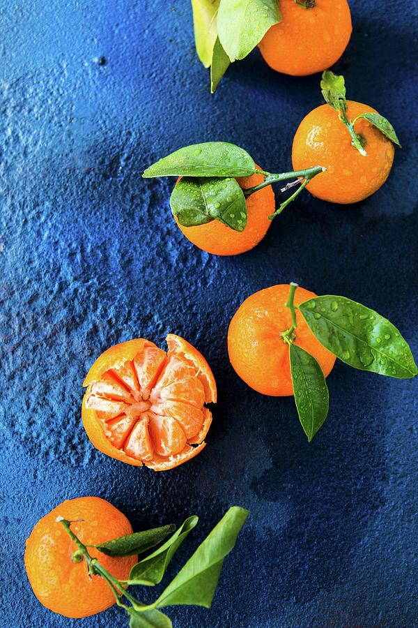 Clementine Segments With Whole Clementines Photograph by Aniko Takacs ...