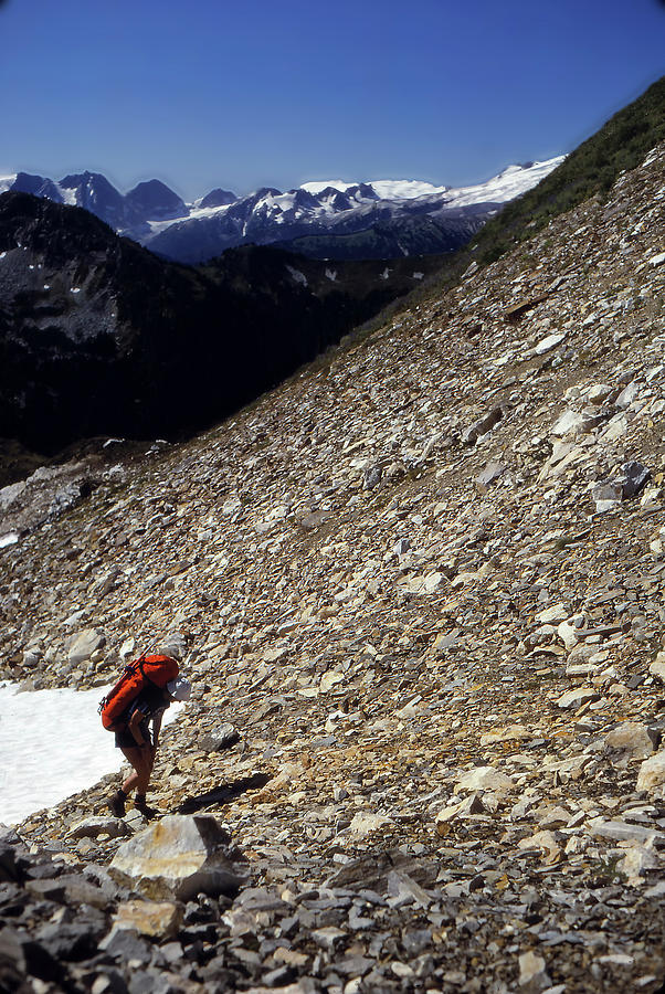 Climber on scree in the North Cascades Photograph by Steve Estvanik