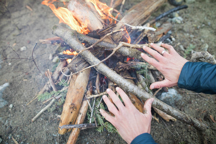 Climber Warms His Hands Over A Fire Photograph by Christopher Kimmel ...