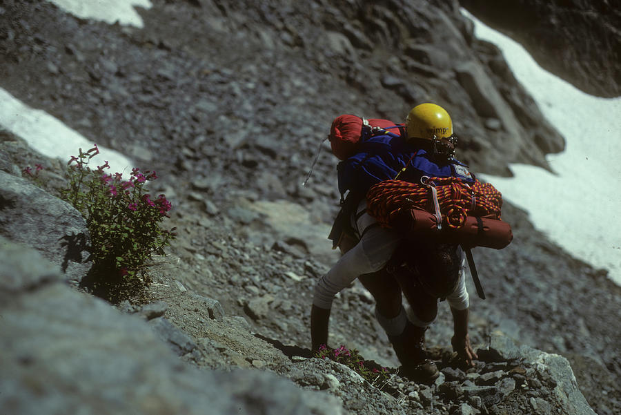 Climber with full pack on Eldorado Peak Photograph by Steve Estvanik