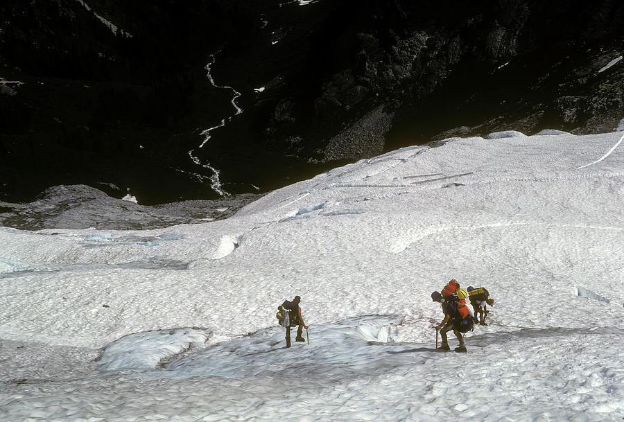 Climbers descending glacier and icefall near Mt. Challenger, North Cascades National Park Photograph by Steve Estvanik