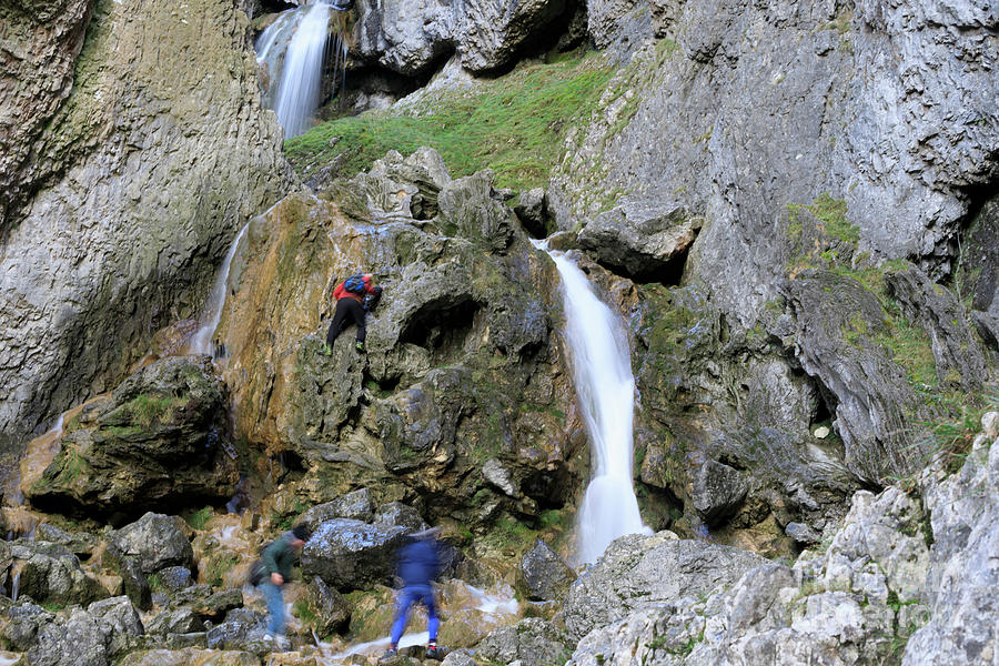 Climbers making their way up the cliffs of Gordale Scar Photograph by ...