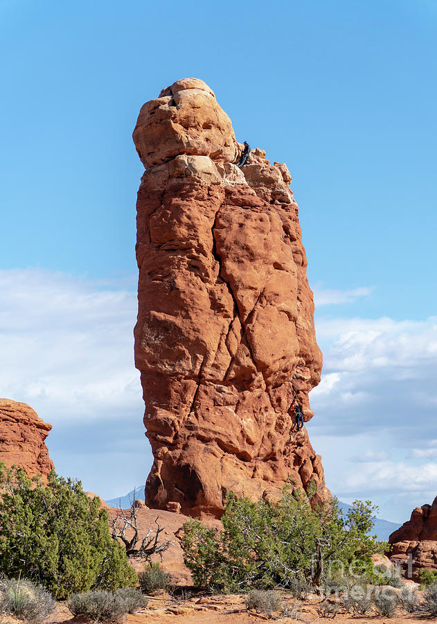 Climbers on Owl Rock at Arches National Park, Moab, Utah USA.  Photograph by William Kuta