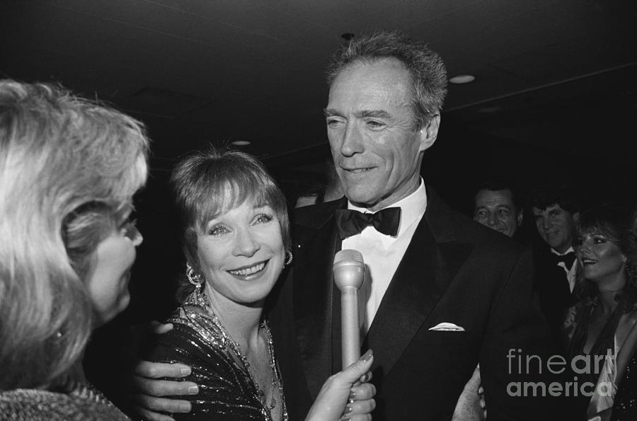 Clint Eastwood Hugs Shirley Maclaine Photograph by Bettmann