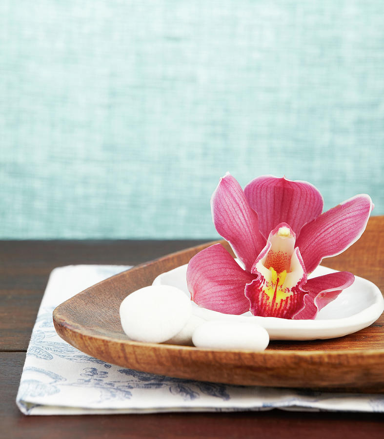 Close Up Of A Pink Orchid On Wooden Tray Photograph by Gspictures