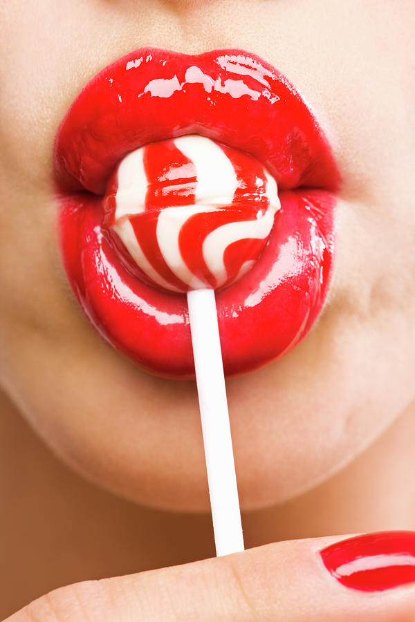Close-up Of A Womans Mouth With Lollipop Photograph by Pando Hall