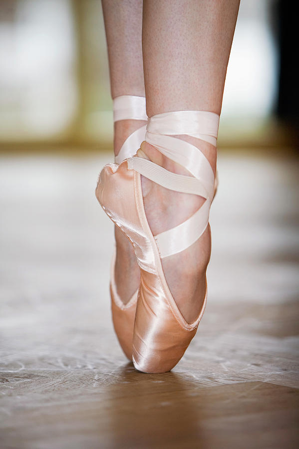 Close-up Of Ballet Dancer On Tiptoes Photograph by Beyond Foto