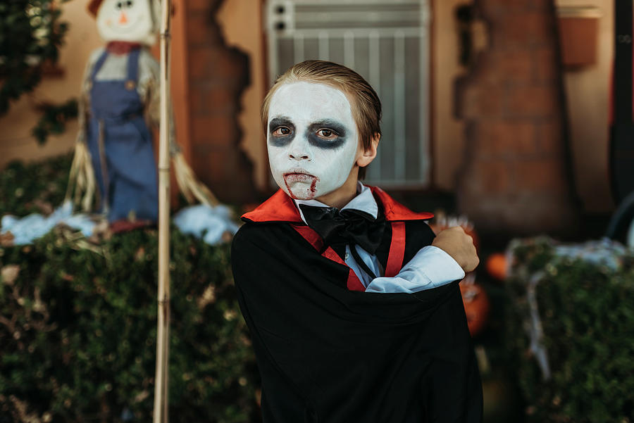 Halloween Photograph - Close Up Of Boy Dressed As Dracula Posing In Costume At Halloween by Cavan Images